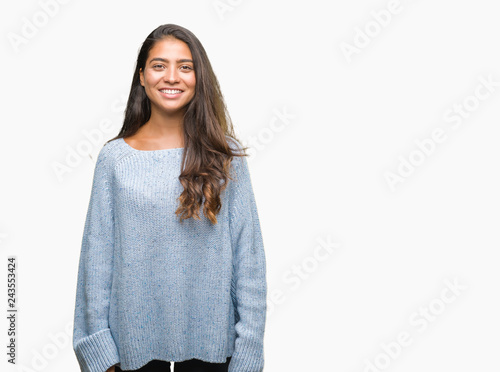 Young beautiful arab woman wearing winter sweater over isolated background with a happy and cool smile on face. Lucky person. © Krakenimages.com