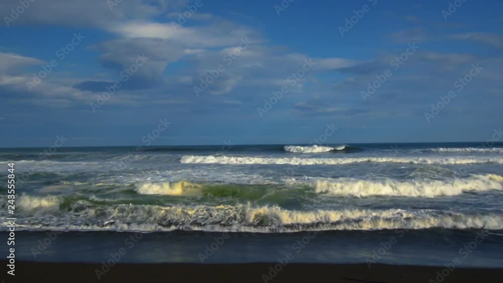 Khalaktyrsky Beach. Seascape Kamchatka Peninsula: view of the beach of volcanic sand in Pacific Ocean. Russia Far East, Eurasia