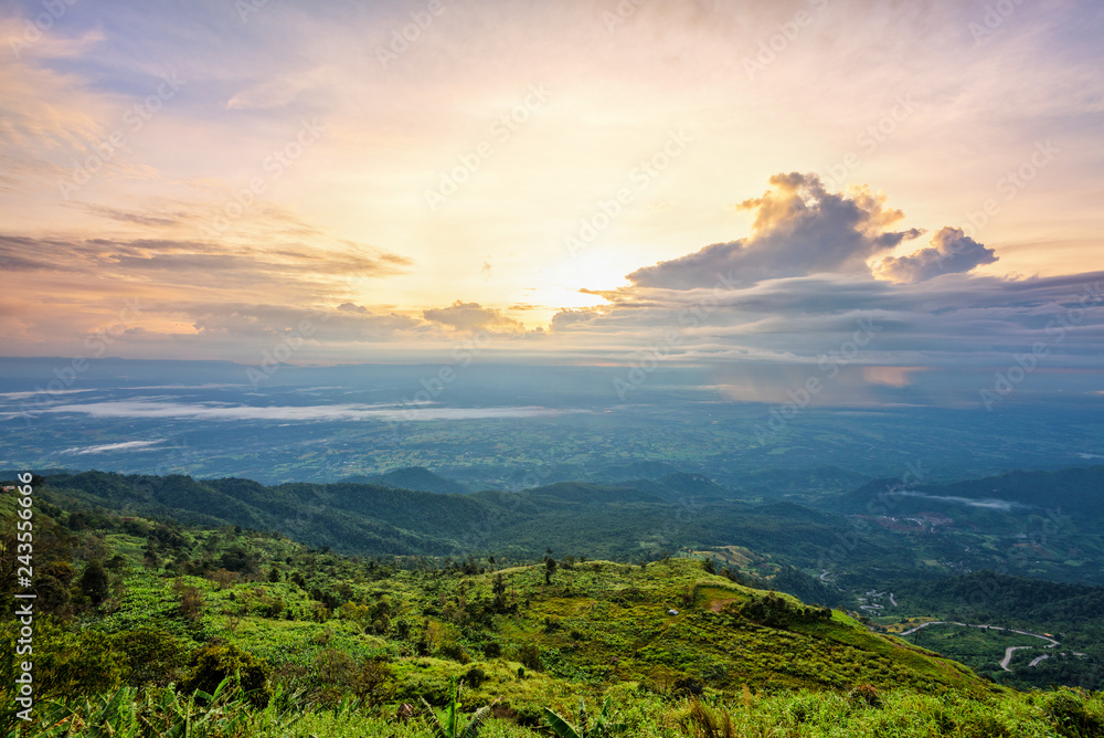 High view beautiful nature landscape of colorful sky during the sunrise on top of the mountain at Phu Thap Berk viewpoint, famous tourist attractions of Phetchabun Province, Thailand