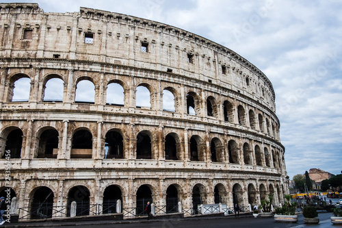 Coliseum or Flavian Amphitheatre or Colosseum  Amphitheatrum Flavium or Colosseo   Rome  Italy. Cloudy blue sky