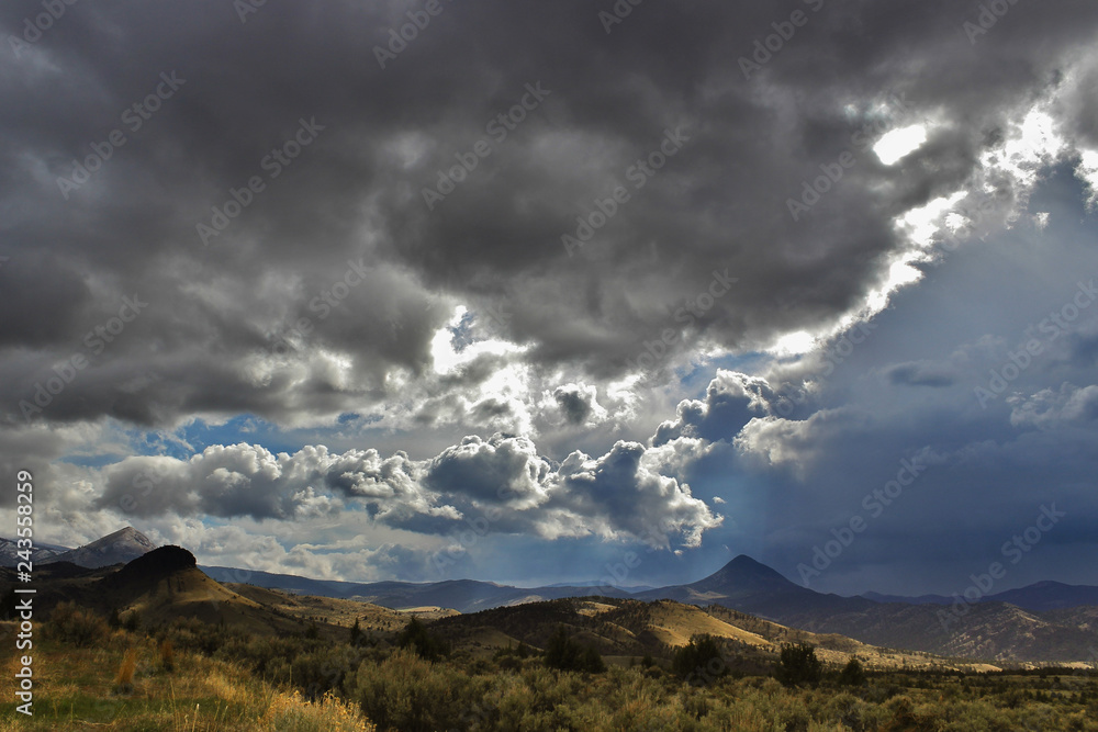 Hills with storm clouds brewing in the high desert.