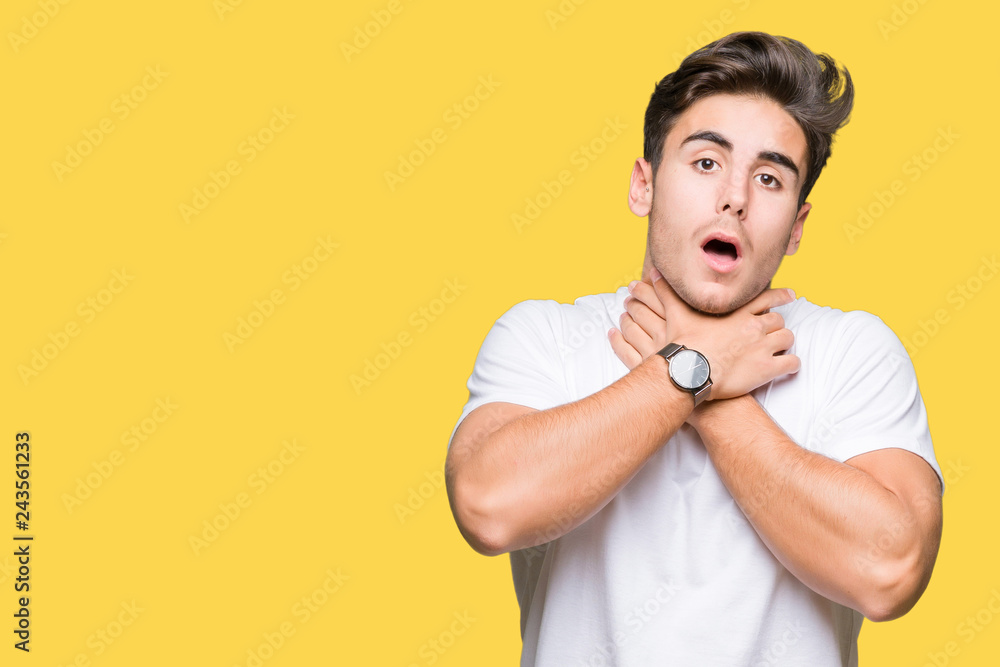 Young handsome man wearing white t-shirt over isolated background shouting and suffocate because painful strangle. Health problem. Asphyxiate and suicide concept. Young handsome man wearing white t-shirt over isolated background shouting and suffocate because painful strangle. Health problem. Asphyxiate and suicide concept.