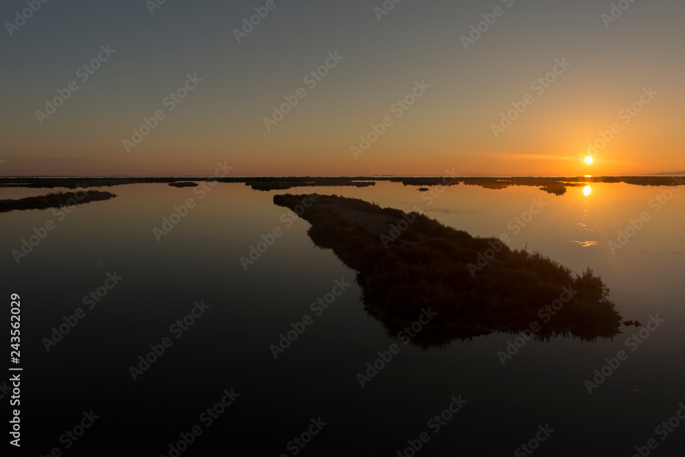 Sunset in the ebro delta by the sea