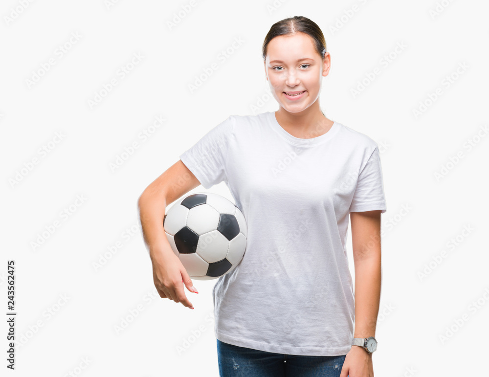 Young beautiful caucasian woman holding soccer football ball over isolated background with a happy face standing and smiling with a confident smile showing teeth