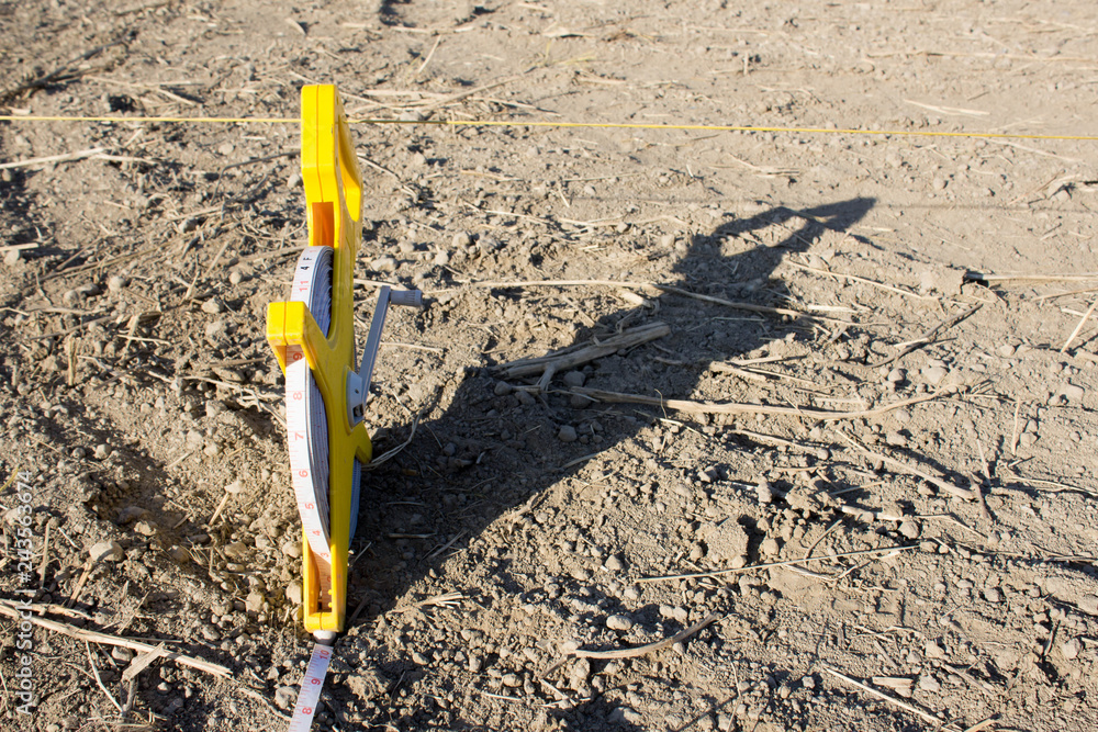 Roulette geodesic 100 meters on floor sand Roulette geodesic 100 meters on floor sand