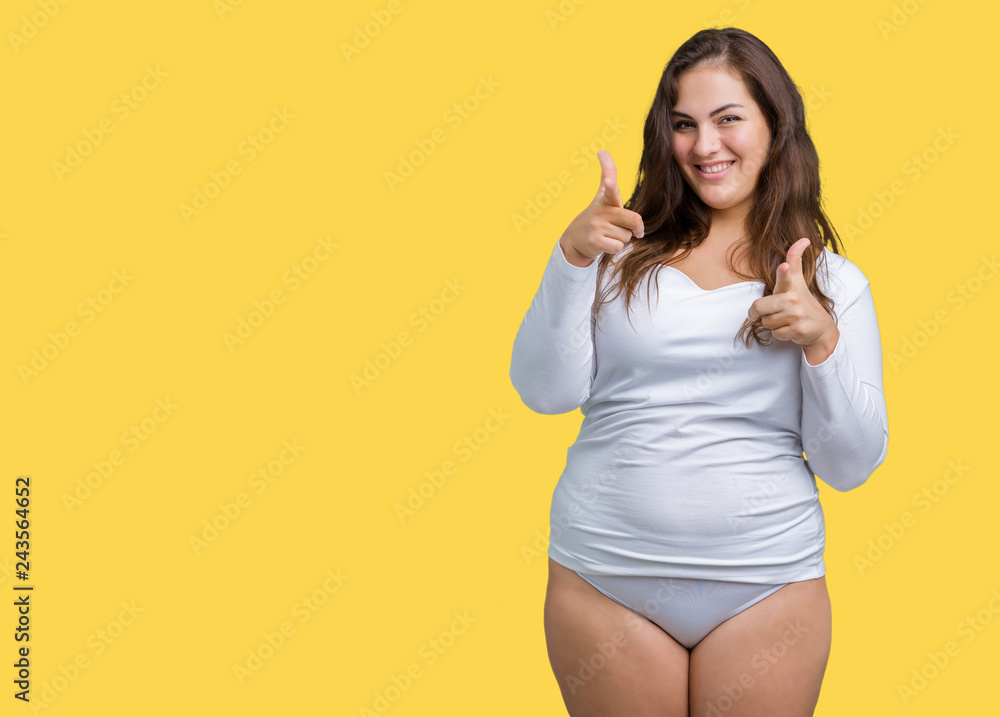 Beautiful plus size young overwight woman wearing white underwear over isolated background pointing fingers to camera with happy and funny face. Good energy and vibes. Beautiful plus size young overwight woman wearing white underwear over isolated background pointing fingers to camera with happy and funny face. Good energy and vibes.
