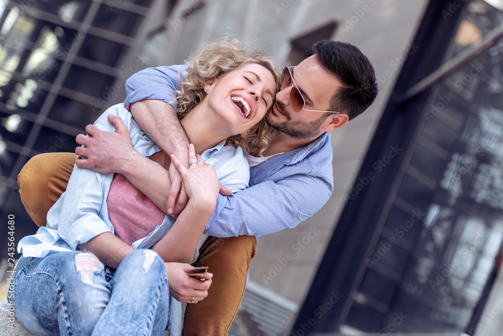 Couple sitting on stairs and hugging Couple sitting on stairs and hugging