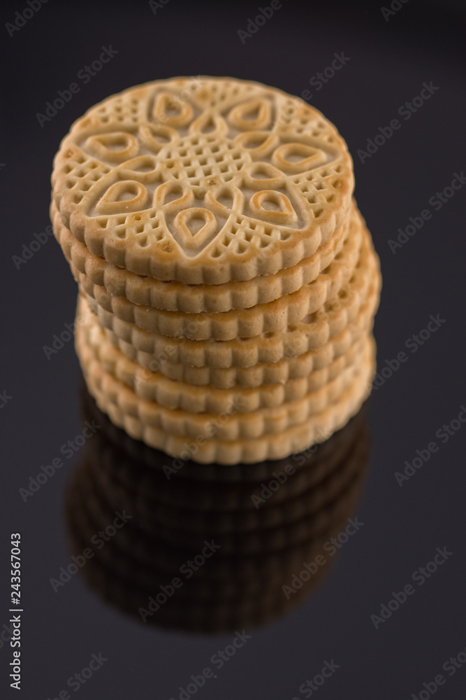 ,round, biscuit cracker isolated on black background ,round, biscuit cracker isolated on black background