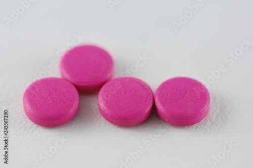 pink pills, tablets , capsules © Laurenx