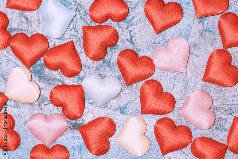 Cloth hearts scattered on the table. Abstract Valentine day background. Cloth hearts scattered on the table. Abstract Valentine day background.