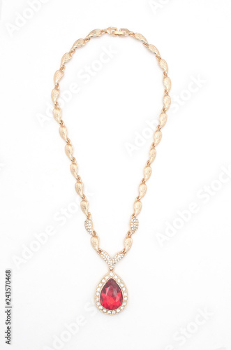 golden pendant with ruby and diamonds isolated on white