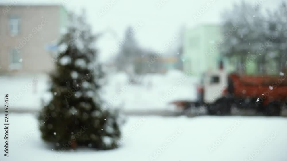 blurred background of falling snow in the winter on the road. Driving snow plow. blurred background of falling snow in the winter on the road. Driving snow plow.