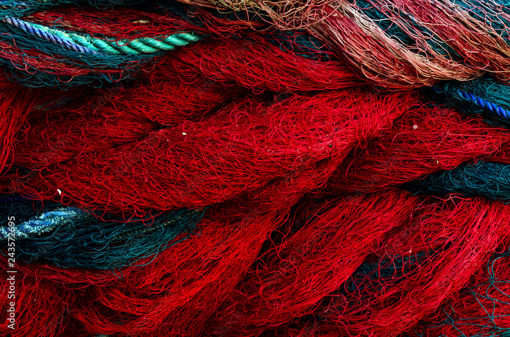 Fishing nets. Background with blue and red ropes. Fishing nets. Background with blue and red ropes.