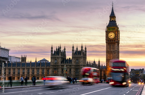 London, the UK. Red bus in motion and Big Ben, the Palace of Westminster. The icons of England © daliu