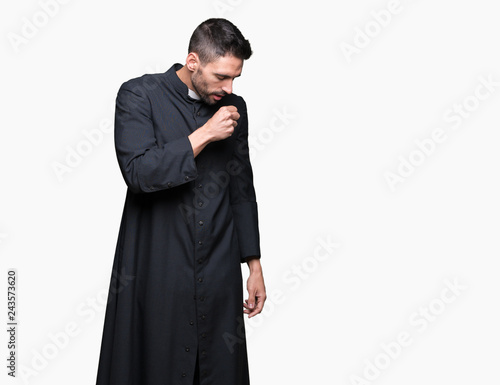 Young Christian priest over isolated background feeling unwell and coughing as symptom for cold or bronchitis. Healthcare concept.