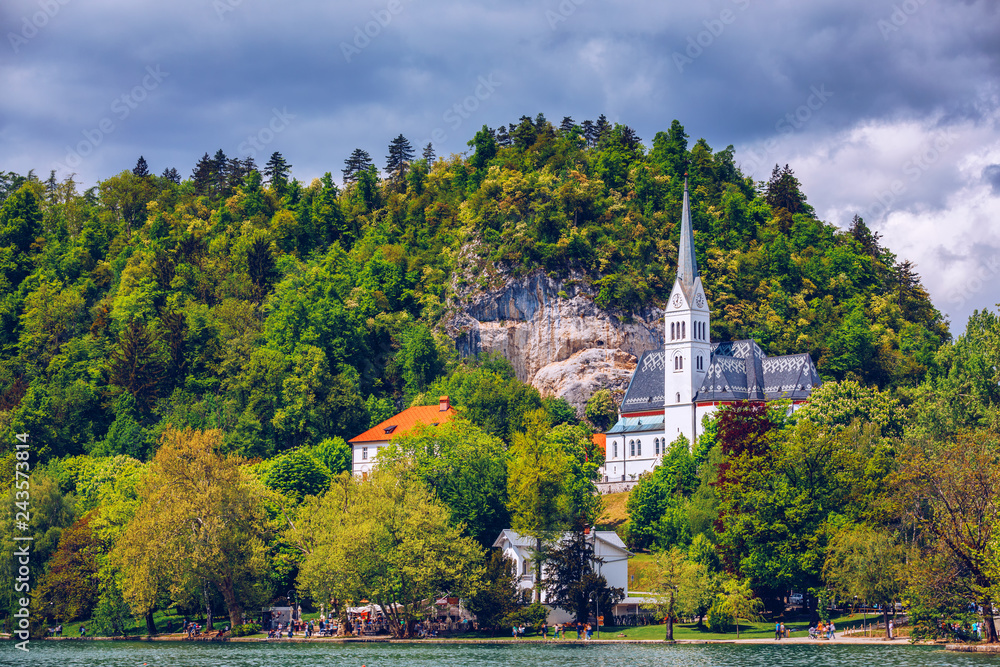 The Picturesque of St. Martin's Parish Church on the Hill by the Lake Bled of Slovenia. St Martin's Church on the shores of Lake Bled, Slovenia The Picturesque of St. Martin's Parish Church on the Hill by the Lake Bled of Slovenia. St Martin's Church on the shores of Lake Bled, Slovenia