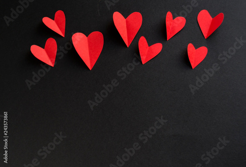 Valentine hearts on a black background. Happy moments. Valentine's day background photo