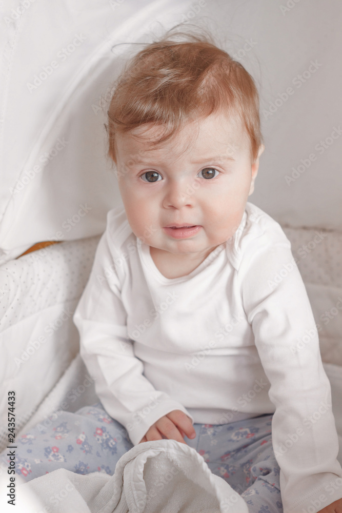 Portrait of joyfil, happiness baby in the bedroom, blurred background