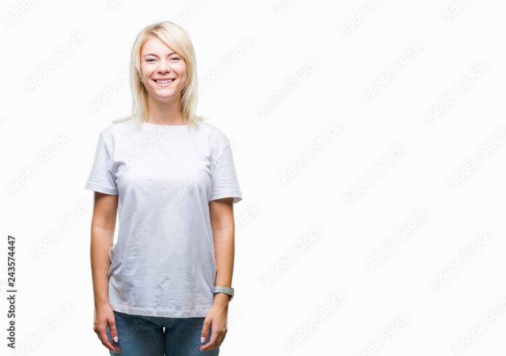 Young beautiful blonde woman wearing white t-shirt over isolated background with a happy and cool smile on face. Lucky person. Young beautiful blonde woman wearing white t-shirt over isolated background with a happy and cool smile on face. Lucky person.
