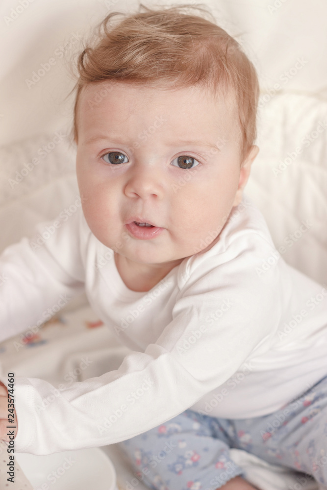 Portrait of joyfil, happiness baby in the bedroom, blurred background Portrait of joyfil, happiness baby in the bedroom, blurred background