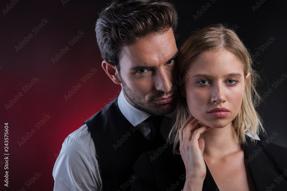 Sexy attractive young couple dressed in smart elegant clothes Sexy attractive young couple dressed in smart elegant clothes