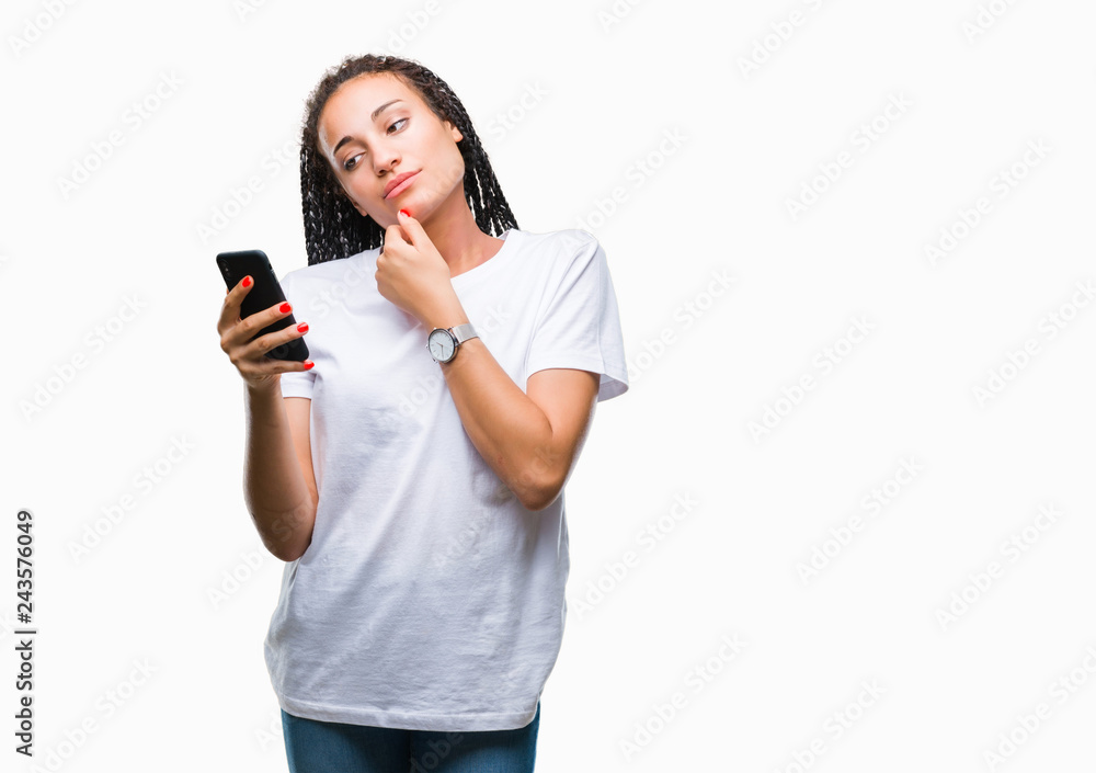 Young braided hair african american girl showing using smartphone over isolated background serious face thinking about question, very confused idea Young braided hair african american girl showing using smartphone over isolated background serious face thinking about question, very confused idea