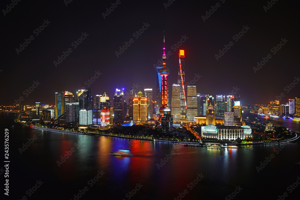 A night view of the modern Pudong skyline across the Bund in Shanghai, China