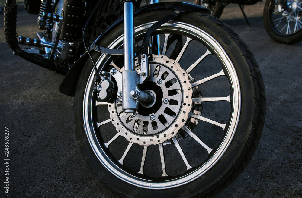  wheel motorcycle. bike wheel close-up, biker background.
