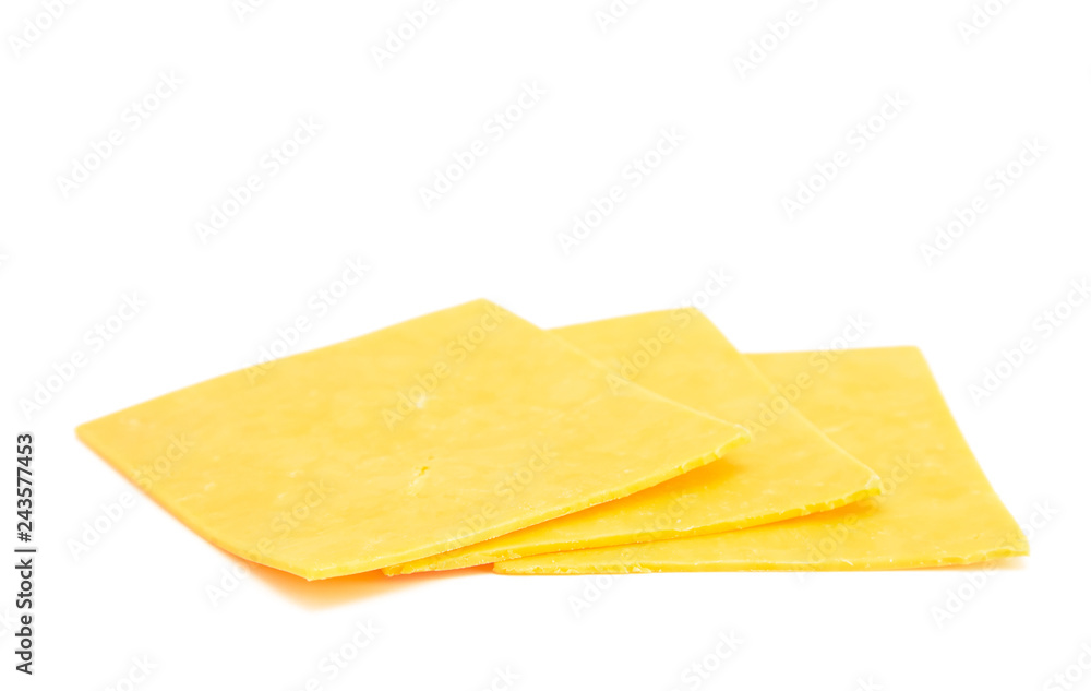 Slices of Cheddar Cheese on a White Background Slices of Cheddar Cheese on a White Background