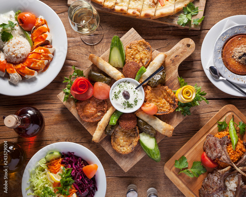 Arabic food, top down shot - Delicious turkish meals, beautifully arranged oriental dishes on a wooden table photo