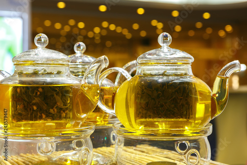 Freshly brewed tea in a glass teapot