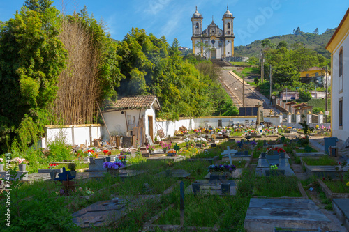 Cemitério da Igreja São José com Igreja são Francisco de Paula ao fundo, Ouro Preto, Brasil photo