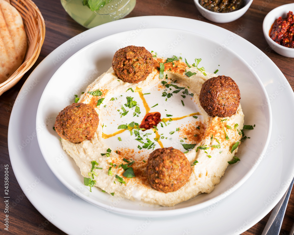 Arabic food, Falafel Humus - Delicious humus with falafel, beautifully arranged on a white plate
