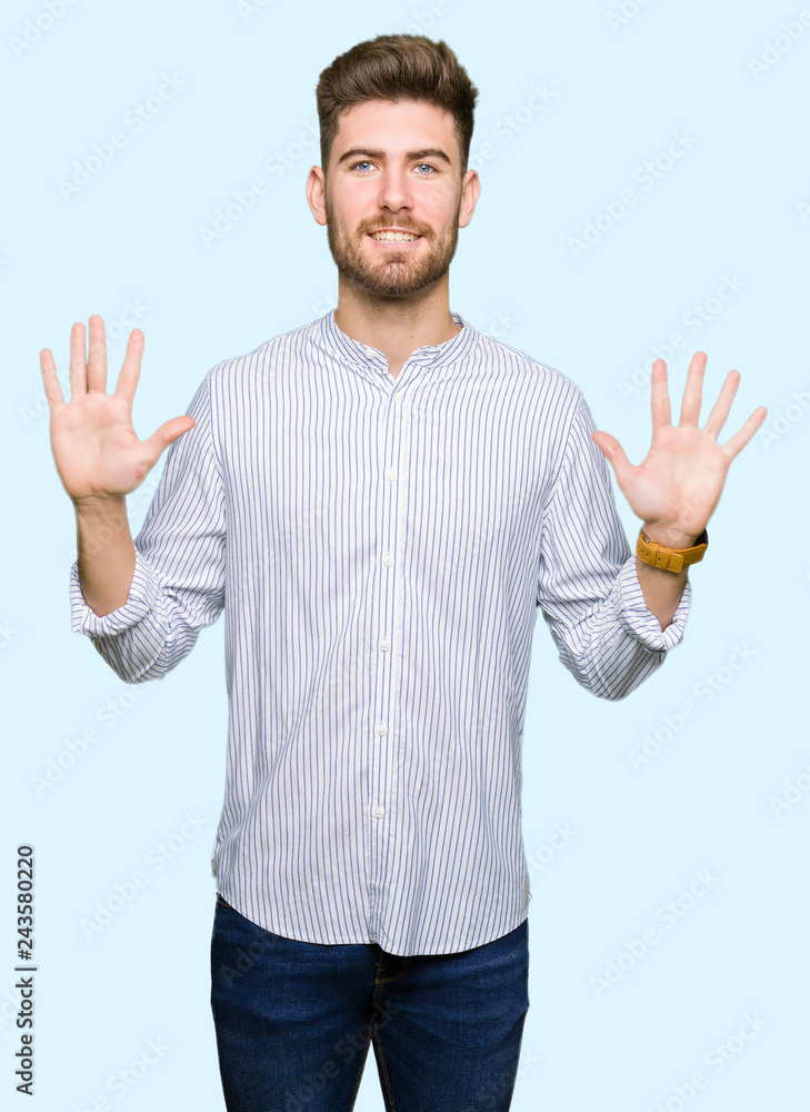 Young handsome man showing and pointing up with fingers number ten while smiling confident and happy. Young handsome man showing and pointing up with fingers number ten while smiling confident and happy.