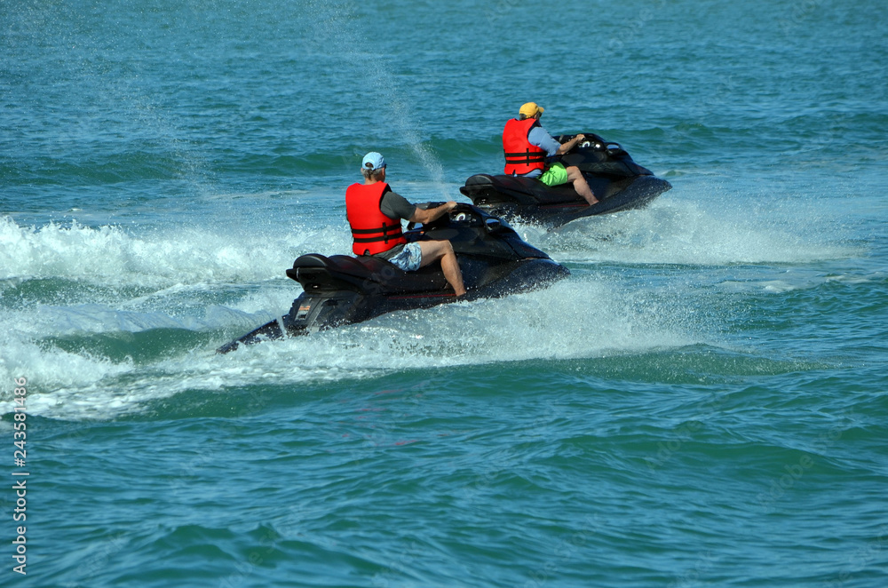 Older jet skiers riding on the Florida Intra-Coastal Waterway