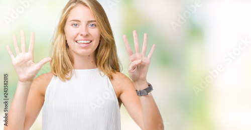 Beautiful young elegant woman over isolated background showing and pointing up with fingers number nine while smiling confident and happy.