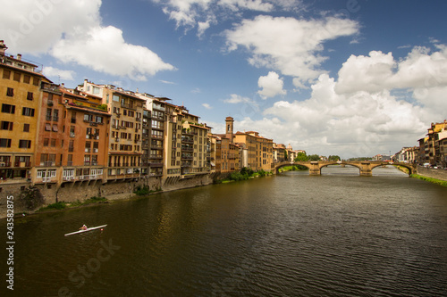 Morning Exercise - A lone oarsman rows along the Arno River on a beautiful summer morning. Ponte Vecchio over River Arno. Florence, Italy © GibsonOutdoorPhoto