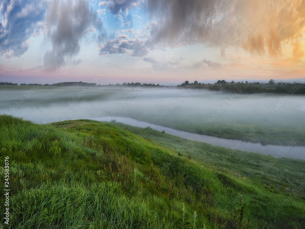 spring morning valley of the picturesque river. foggy dawn