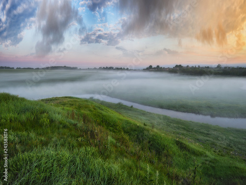 spring morning valley of the picturesque river. foggy dawn © sergnester