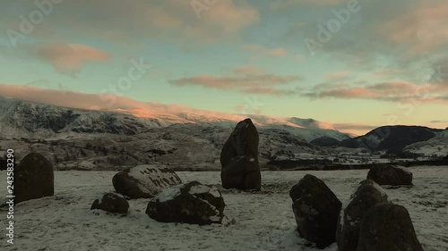 Beautiful winter scenery in the English Lake District, home of Beatrix Potter. A stunning early morning shot of an historic English stone circle or standing stones in Cumbria. UK tourist destination. photo