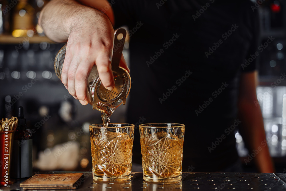 Spill a cocktail. Party. The barman is preparing a cocktail