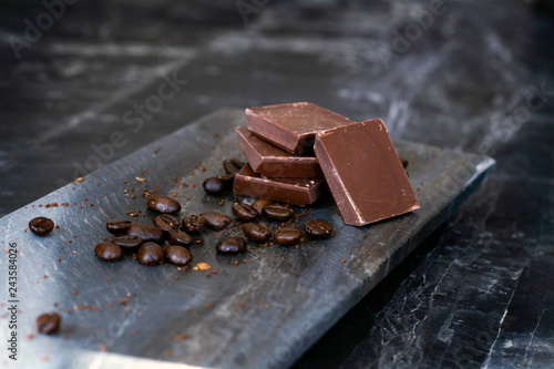 milk chocolate and coffee beans in kitchen for dessert making
