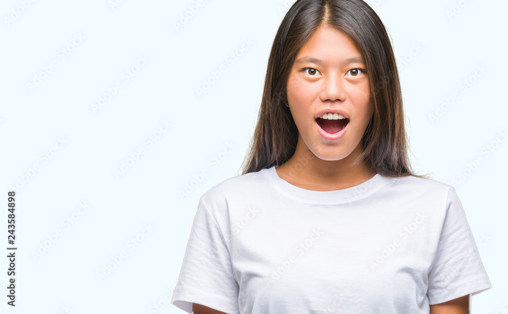 Young asian woman over isolated background afraid and shocked with surprise expression, fear and excited face. Young asian woman over isolated background afraid and shocked with surprise expression, fear and excited face.