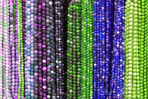 Colorful Beads Background. Background pattern of multicolored natural stone beads. String of beads in various colors. Colorful beads necklaces. Handicraft fashionable for women