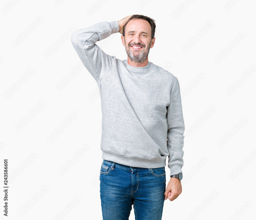 Handsome middle age senior man wearing a sweatshirt over isolated background Smiling confident touching hair with hand up gesture, posing attractive Handsome middle age senior man wearing a sweatshirt over isolated background Smiling confident touching hair with hand up gesture, posing attractive