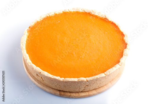 Traditional american sweet pumpkin pie isolated on white background.