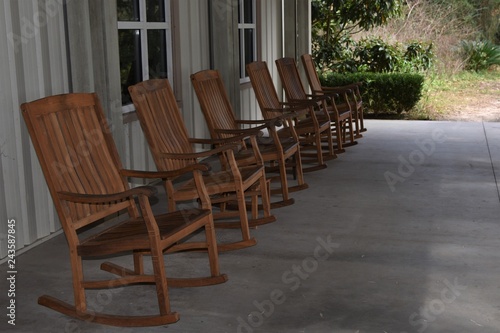 Wooden rocking chairs in a row