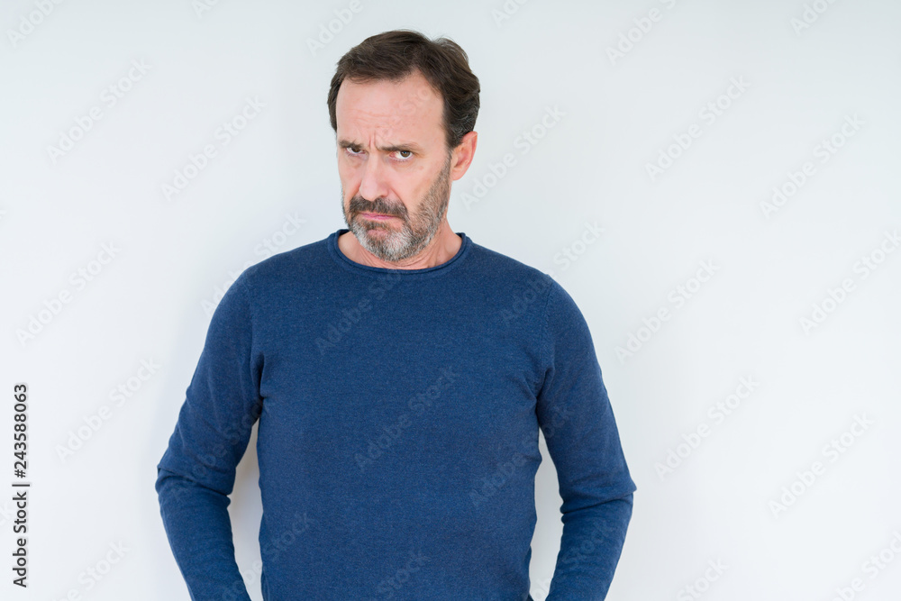 Elegant senior man over isolated background skeptic and nervous, frowning upset because of problem. Negative person. Elegant senior man over isolated background skeptic and nervous, frowning upset because of problem. Negative person.