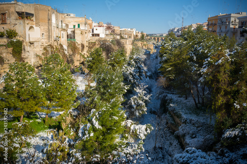 Horizontal View of the Gravina of the Town of Massafra, Covered by Snow on Blue Sky Background