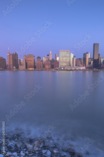 View on Manhattan from east river at sunrise with long exposure